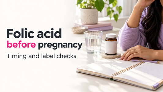 Pregnancy-planning notebook beside a glass of water and an unbranded supplement bottle, illustrating folic-acid preparation.