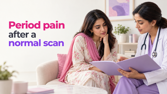 South Asian woman discussing continuing pelvic pain and a scan report with a clinician