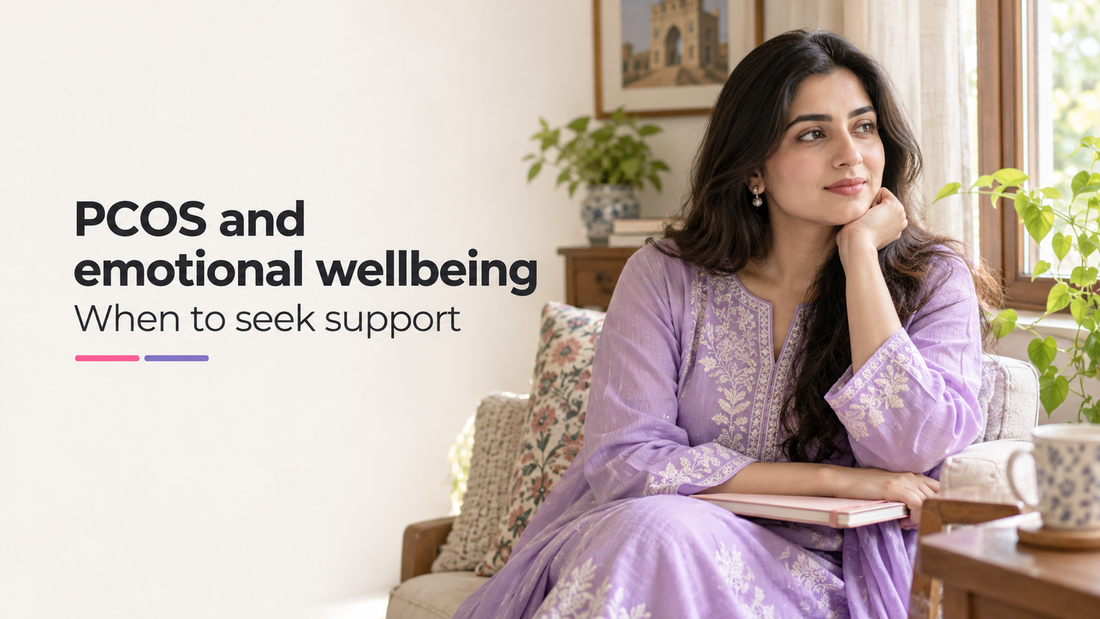 South Asian woman sitting beside a window with a notebook, illustrating a guide to PCOS and emotional wellbeing.