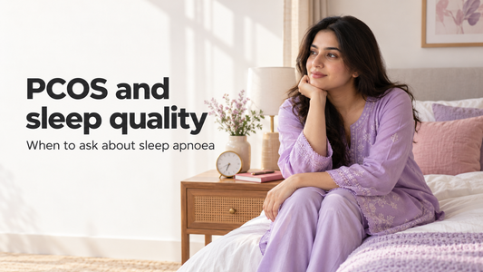 South Asian woman seated beside a neatly made bed in morning light, illustrating a guide to PCOS and sleep assessment.